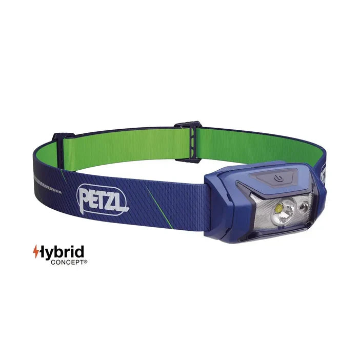 Blue and green Petzl Tikka Core Headtorch with Red Light 450 Lumens, featuring a Hybrid Concept design for versatile power options. Blue from  John Bull Clothing