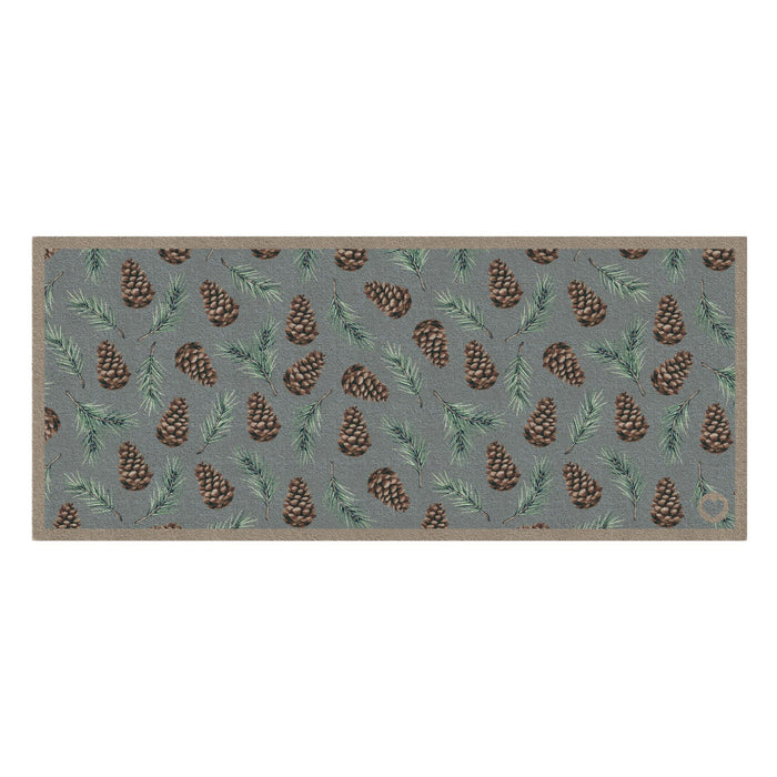 Pinecones Washable runner- 100% recycled cotton runner featuring scattered brown pinecones and green fern leaves.