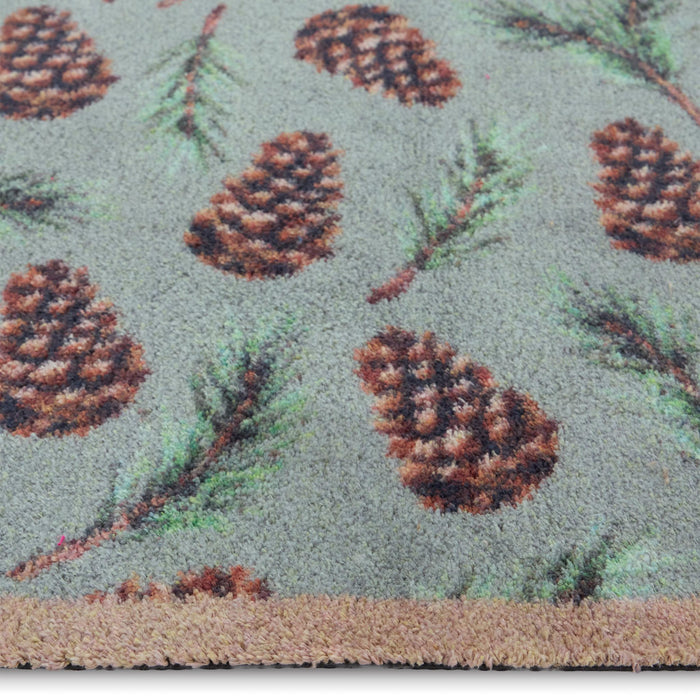 Pinecones Washable runner- 100% recycled cotton runner featuring scattered brown pinecones and green fern leaves.