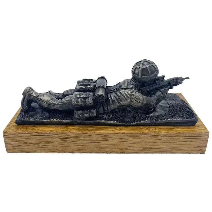 Bronze resin sculpture of a soldier in prone position with SA80 rifle, mounted on oak base, perfect for military collectors.  from  John Bull Clothing