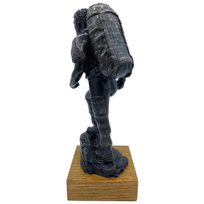 Rear view of PTI Instructor with Bergen Bronze Resin Statue, highlighting intricate backpack design and textured uniform craftsmanship.  from  John Bull Clothing