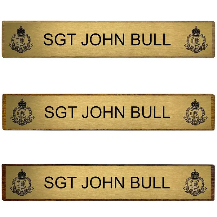 Set of three Regimental Desk Name Plates on Wooden Blocks (Toblerone) with engraved brass plates, displaying military rank and insignia.  from  John Bull Clothing