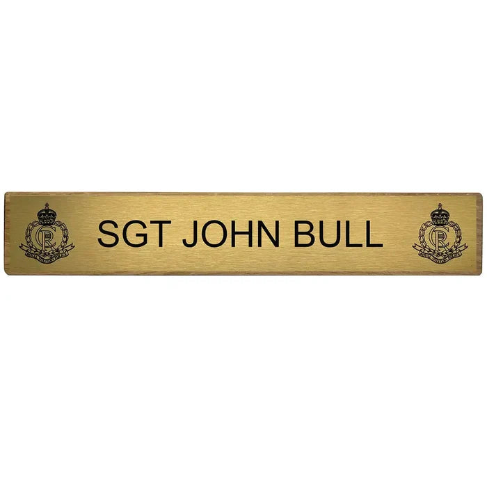 Close-up of Regimental Desk Name Plate on Wooden Block (Toblerone) with engraved brass plate featuring military rank and insignia.  from  John Bull Clothing