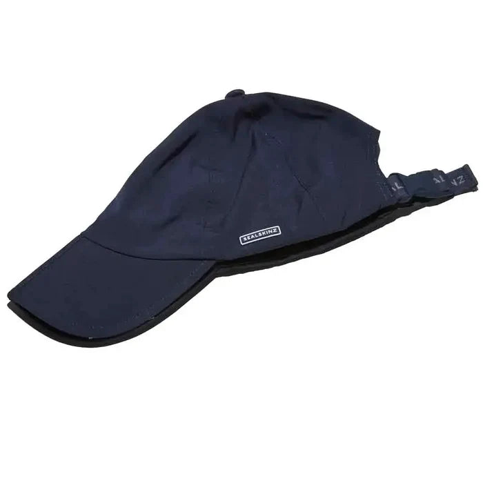 Folded navy Sealskinz Salle Waterproof Peak Cap showing adjustable strap and compact design for easy packing and portability.  from  John Bull Clothing