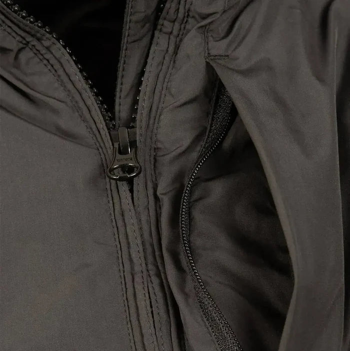 Close-up of Snugpak Arrowhead Insulated Jacket Black zipper and inner lining. High-quality Paratex material ensures insulation and comfort.  from  John Bull Clothing
