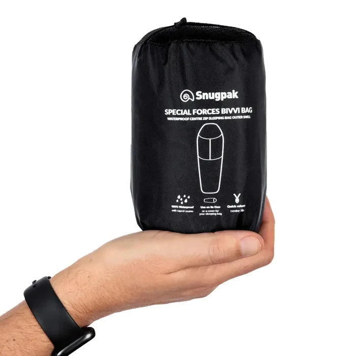 Snugpak Special Forces Waterproof Bivvi Bag WGTE in black compression sack held in hand, highlighting its portable and quick-release camping design.  from  John Bull Clothing