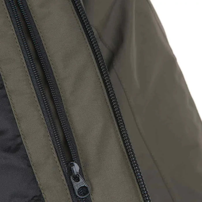 Close-up of dual zippers on Snugpak Torrent Jacket, emphasizing secure closure and insulation protection.  from  John Bull Clothing