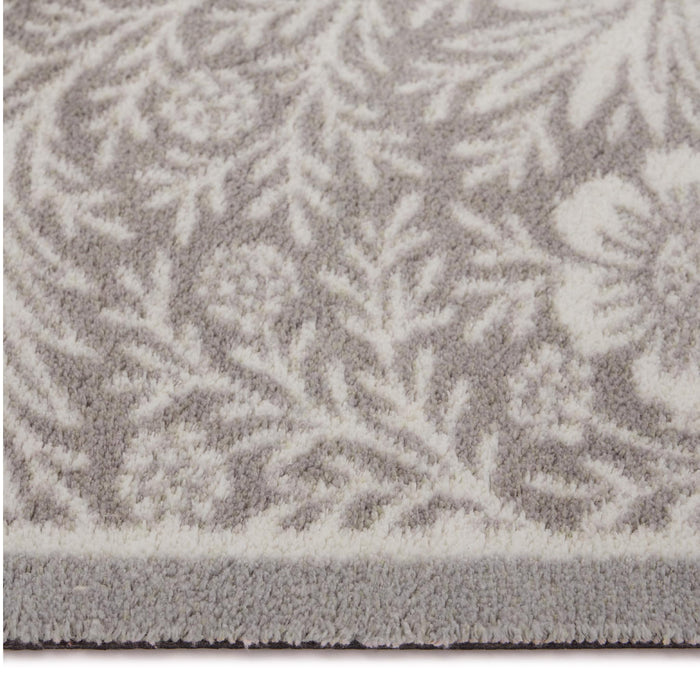 Soft Floral Washable Doormat- a cotton doormat featuring an elegant white floral pattern.