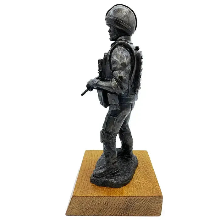 Side profile of British Standing Combat Patrol Bronze Statue showing detailed resin sculpting of uniform, gear, and helmet on oak base.  from  John Bull Clothing