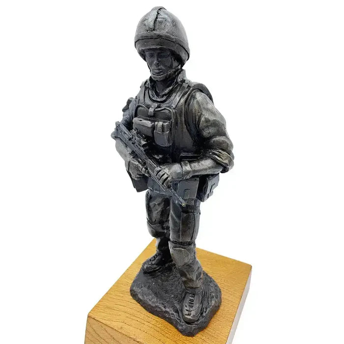 Angled view of British Standing Combat Patrol Bronze Statue showing soldier's alert stance and intricate gear details on oak base.  from  John Bull Clothing