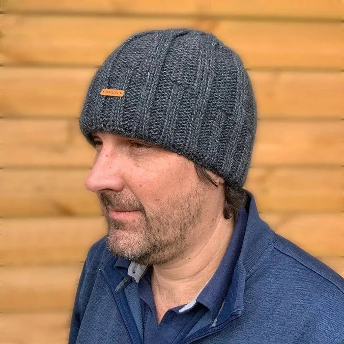 Man wearing Starling Unisex Pullover Beanie Hat 12032 in dark grey, ribbed knit wool design for winter warmth, available at John Bulls.  from  John Bull Clothing