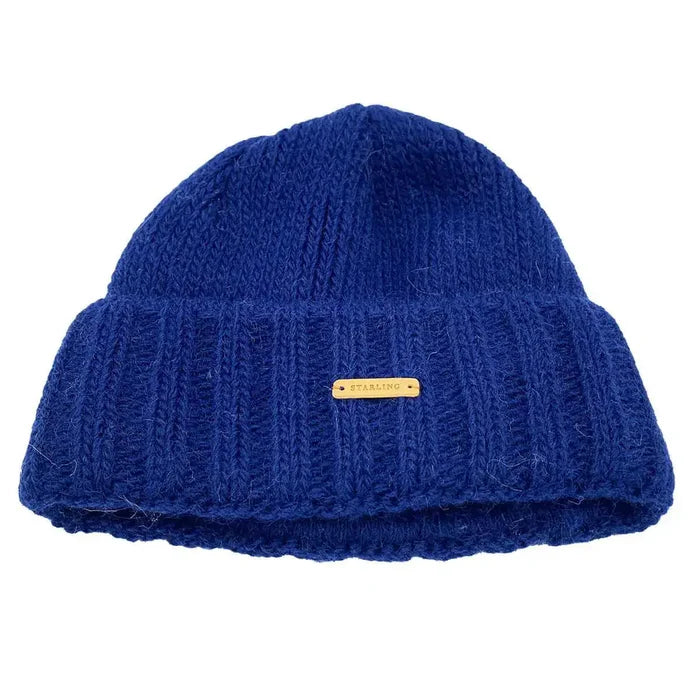 Blue Starling Unisex Rollover Beanie Hat 12033 featuring a thick ribbed knit and logo tag, made for warmth and comfort in winter. Navy from  John Bull Clothing
