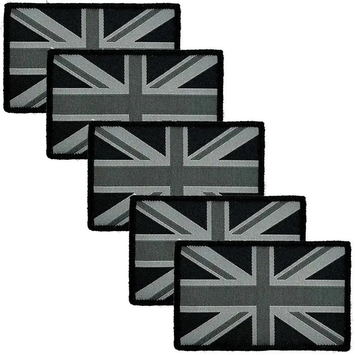 Five black Union Jack patches featuring hook and loop backing, designed for easy attachment to military uniforms and gear. Mono Black from  John Bull Clothing
