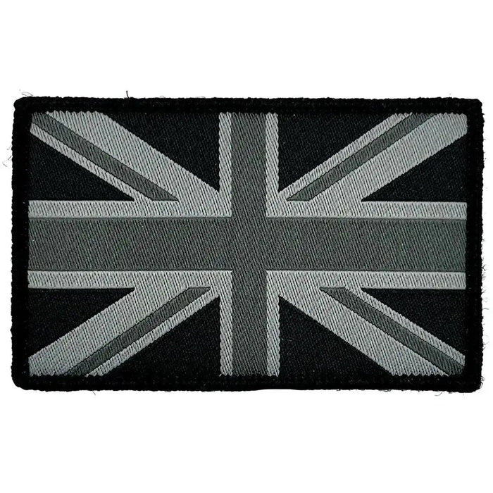 Single black Union Jack patch with hook and loop backing, ideal for tactical clothing and accessories in military settings. Mono Black from  John Bull Clothing