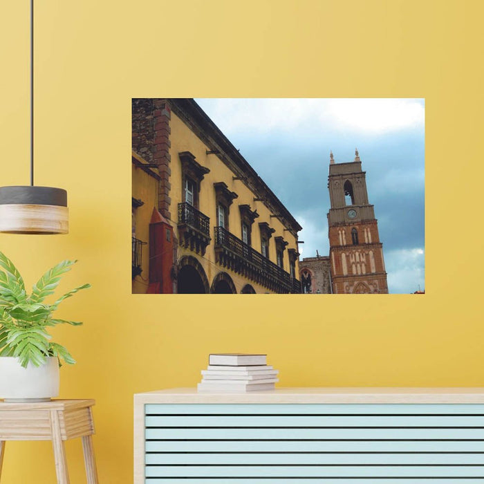 3 inch Mexican Cathedral Tower and hotel poster displayed on wall above a counter