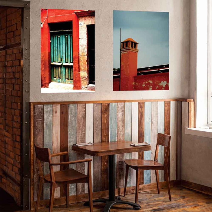 36 inch wall decal of red brick Mexican chimney against a gray sky installed above cafe table and chairs