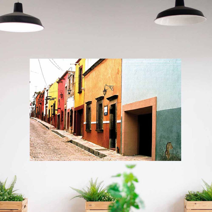60 inch Colorful Mexican street scene with buildings decal on a wall with plants below