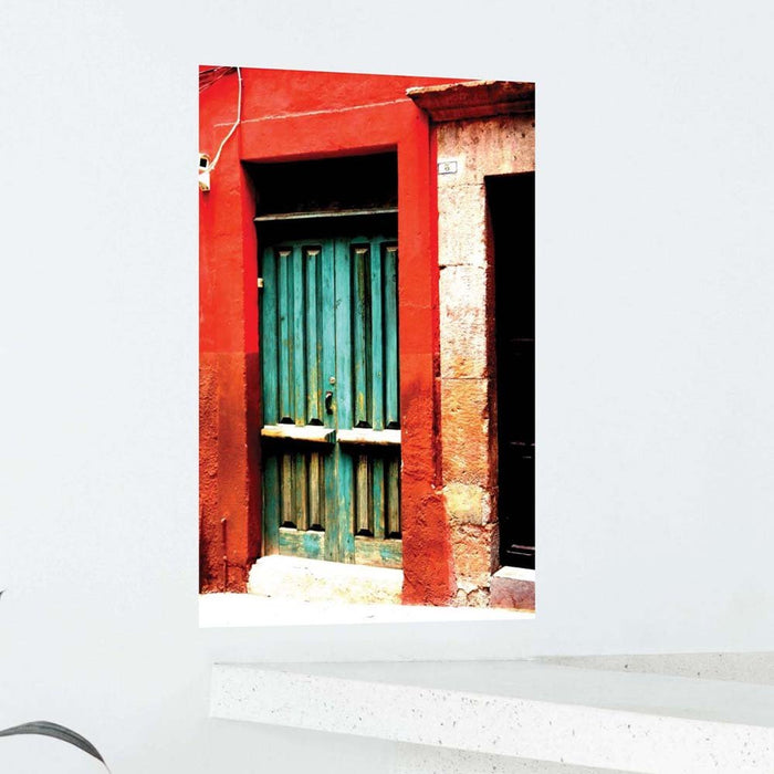 24 inch decal of a red frame with green door of a Mexican home installed on a wall above counter