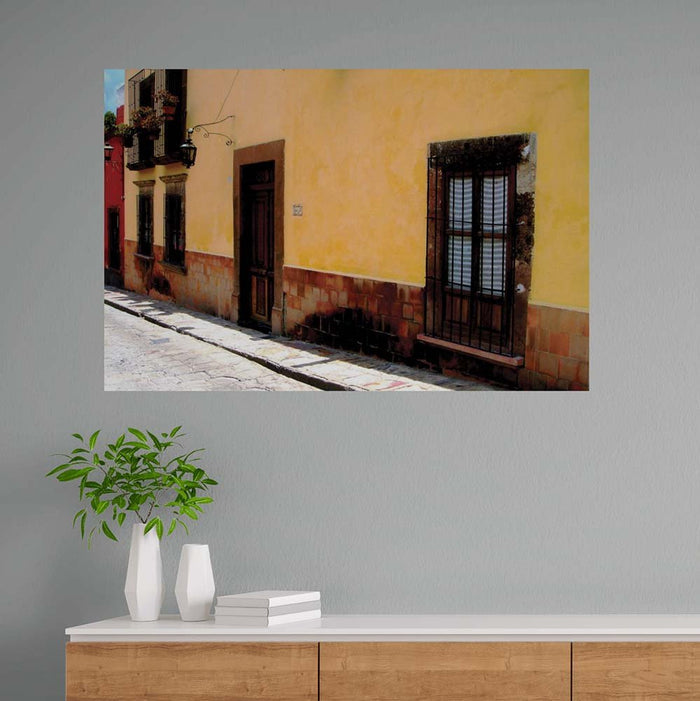 60 inch Mexican street and yellow home architecture decal installed above a counter with vases