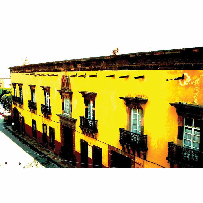Yellow Mexican hotel with dark brown accents gloss poster printed | Wallhogs