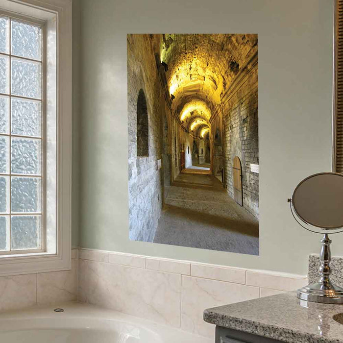 36 inch decal of a long, narrow hallway with arches in Nimes France Roman Arena installed on wall in a bathroom