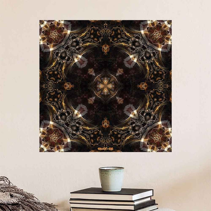 24 inch decal of a kaleidoscope of radiant gold, brown and bronze energy patterns with intricate designs and symmetrical arrangement installed on a wall above a stack of books and cup of coffee