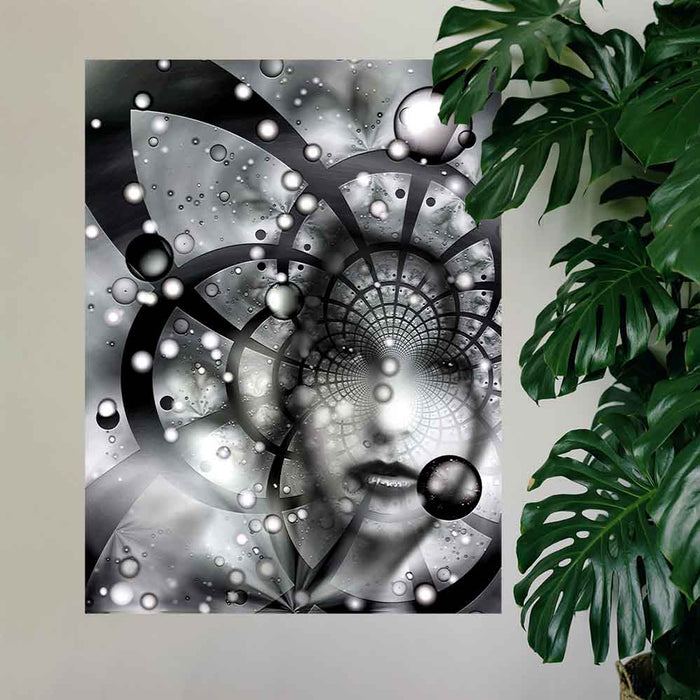 48 inch poster of an abstract black and white fractal artwork features the ghostly visage of a woman emerging from an abstract spiral of cosmic grids, celestial spheres, and radiant particles installed on wall next to large plant