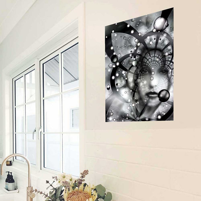 24 inch decal of an abstract black and white artwork capturing a striking face woven into a swirling tapestry of stars, nebulae, and cosmic energy installed in a kitchen next to window