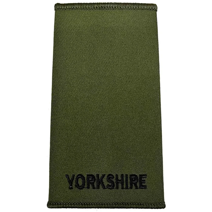 Yorkshire Regiment Rank Slide Olive Green with plain black 'YORKSHIRE' text, made from durable Cordura fabric for military use. Private from  John Bull Clothing